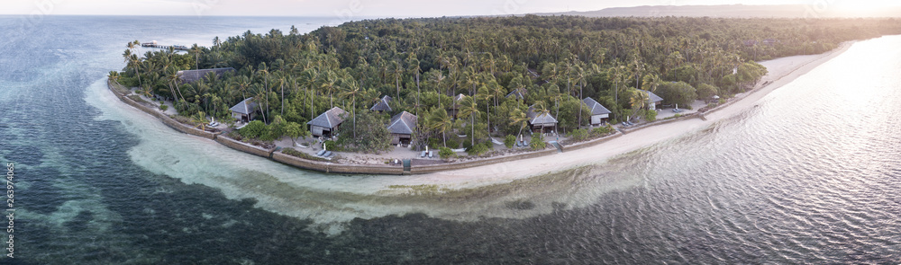 An idyllic tropical resort is found on a remote island in the Wakatobi National Park, Indonesia. This region is known for its incredible coral reefs and high marine biodiversity. An idyllic tropical resort is found on a remote island in the Wakatobi National Park, Indonesia. This region is known for its incredible coral reefs and high marine biodiversity.