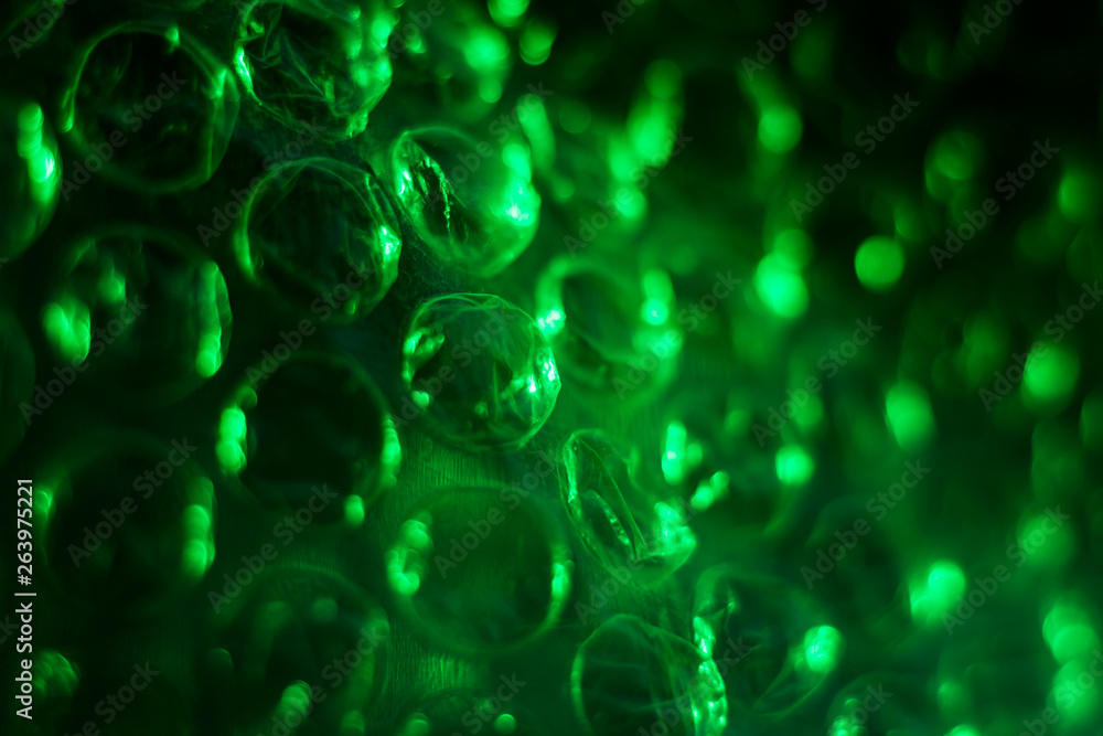 Green cellophane texture with air bubbles, abstract, macro Green cellophane texture with air bubbles, abstract, macro
