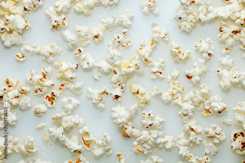 Fresh hot popcorn scattered on the table