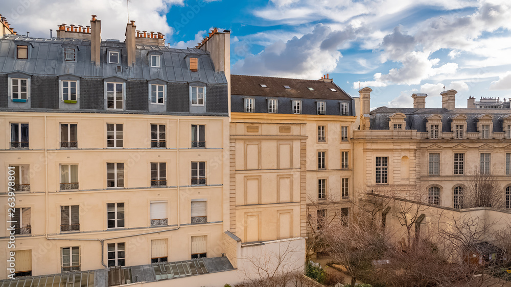 Paris, beautiful building in the center, typical parisian facade in the Marais 