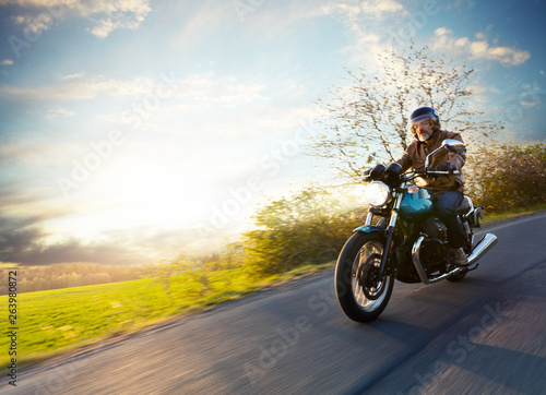Motorcycle driver riding in European road