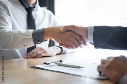 Successful job interview, Boss employer in suit and new employee shaking hands after negotiation and interview, career and placement concept © Ngampol