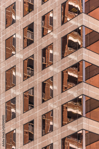 Copper geometric windows in a building