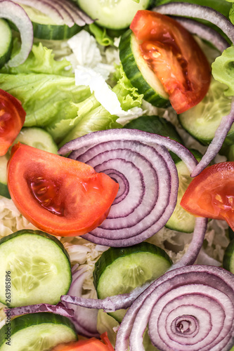 Fresh sliced salad of different vegetables close - up