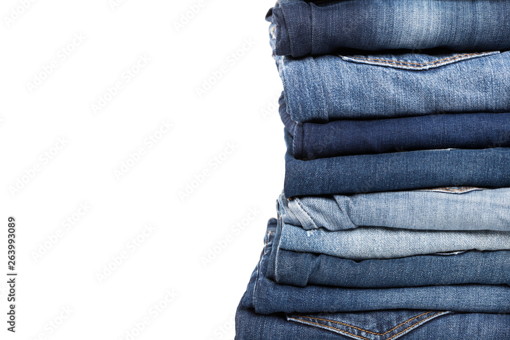 stack of various shades of blue jeans stack of various shades of blue jeans
