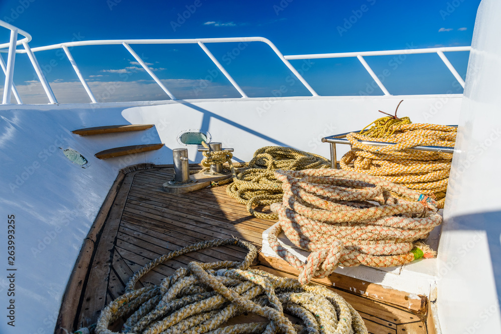 Thick ropes and different tackles on a yacht
