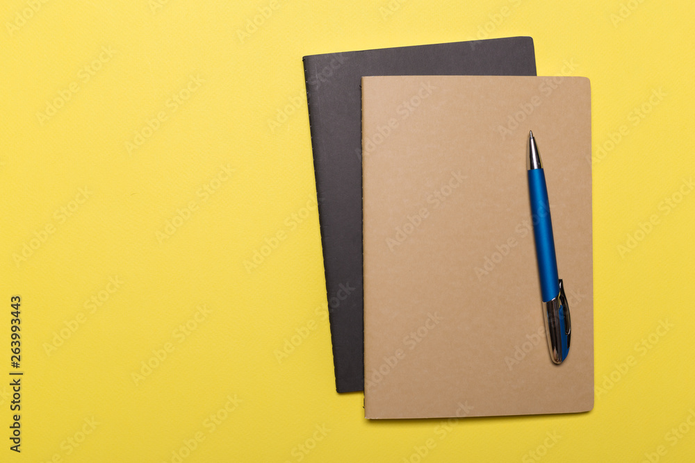 school notebook on a yellow background school notebook on a yellow background