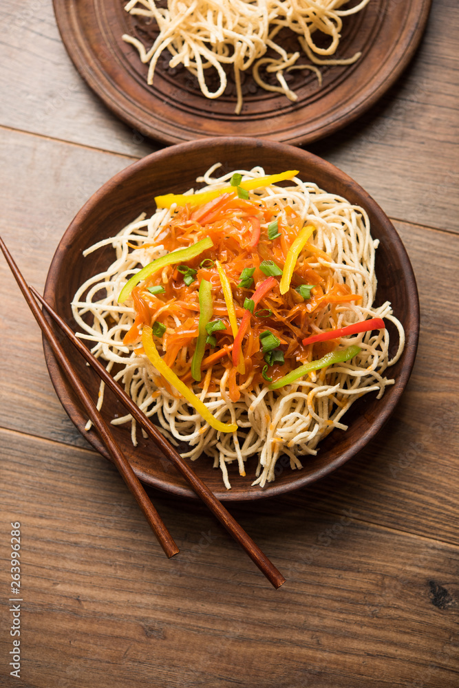 American chop suey/ chopsuey is a popular indochinese food. served in a bowl with chop sticks. selective focus American chop suey/ chopsuey is a popular indochinese food. served in a bowl with chop sticks. selective focus