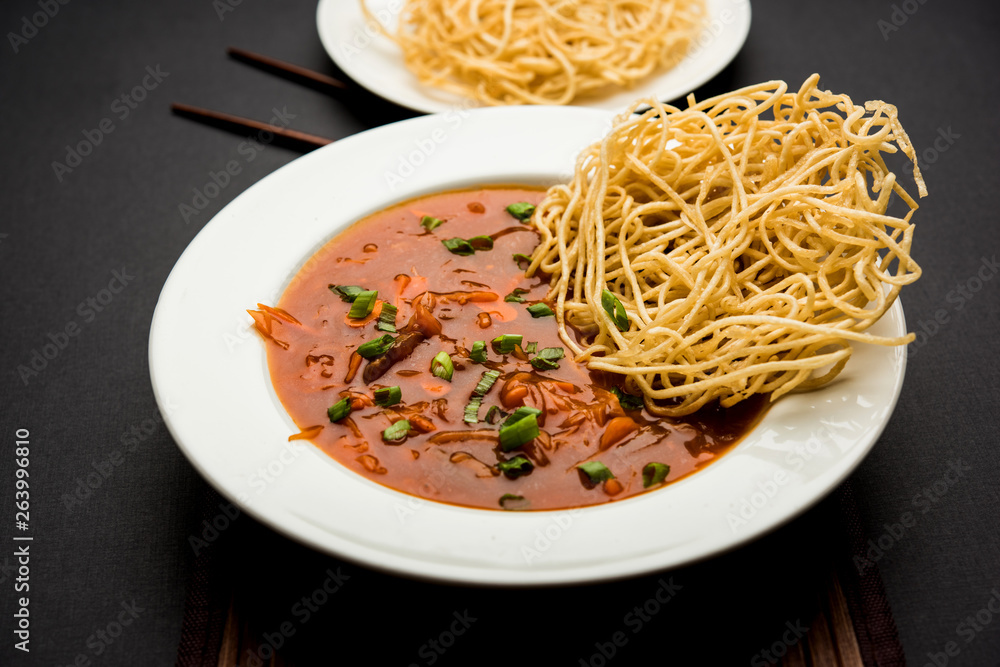 American chop suey/ chopsuey is a popular indochinese food. served in a bowl with chop sticks. selective focus