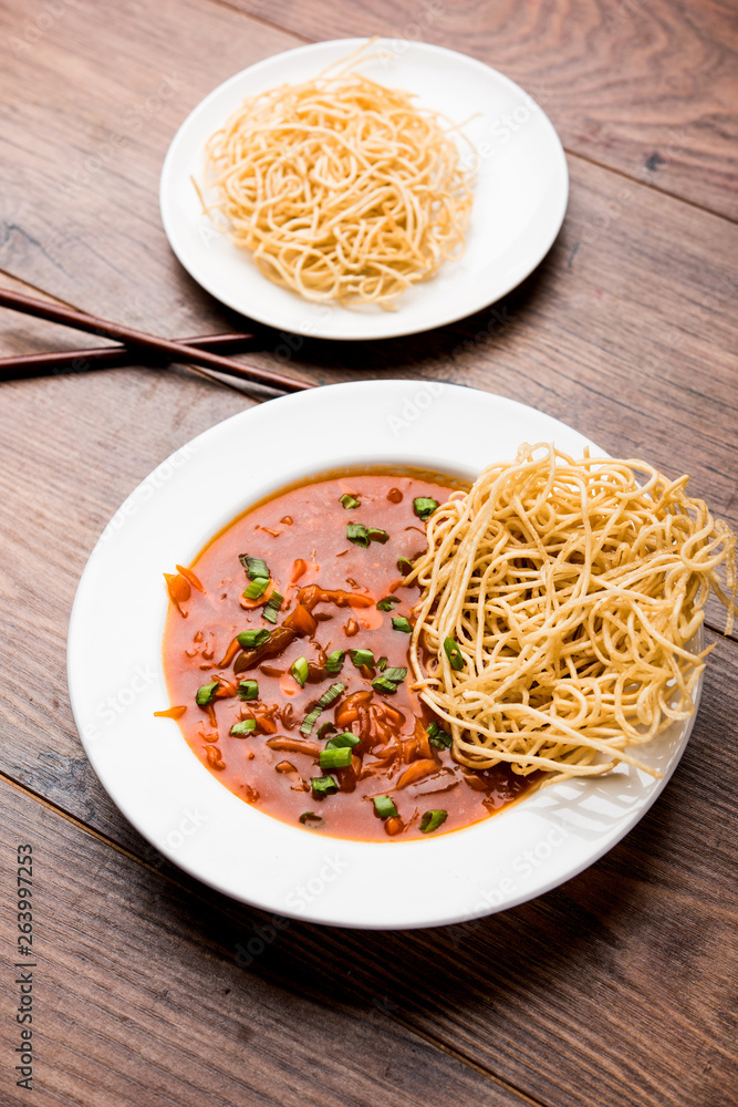 American chop suey/ chopsuey is a popular indochinese food. served in a bowl with chop sticks. selective focus American chop suey/ chopsuey is a popular indochinese food. served in a bowl with chop sticks. selective focus