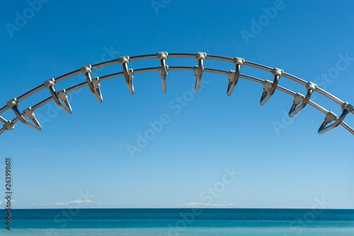 Sea and blue sky with metal bars