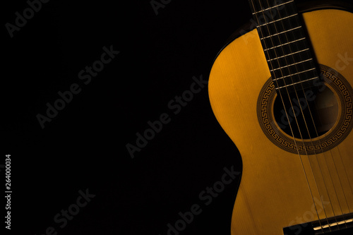 classical guitar case on a black background in the dark