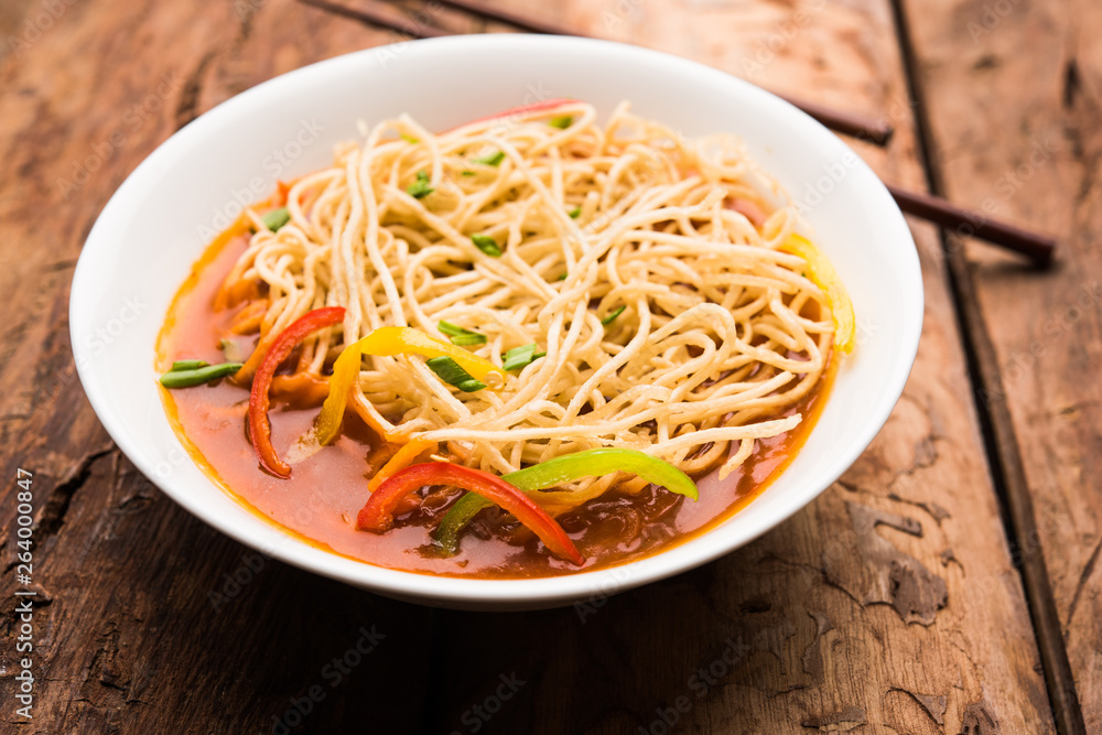American chop suey/ chopsuey is a popular indochinese food. served in a bowl with chop sticks. selective focus American chop suey/ chopsuey is a popular indochinese food. served in a bowl with chop sticks. selective focus