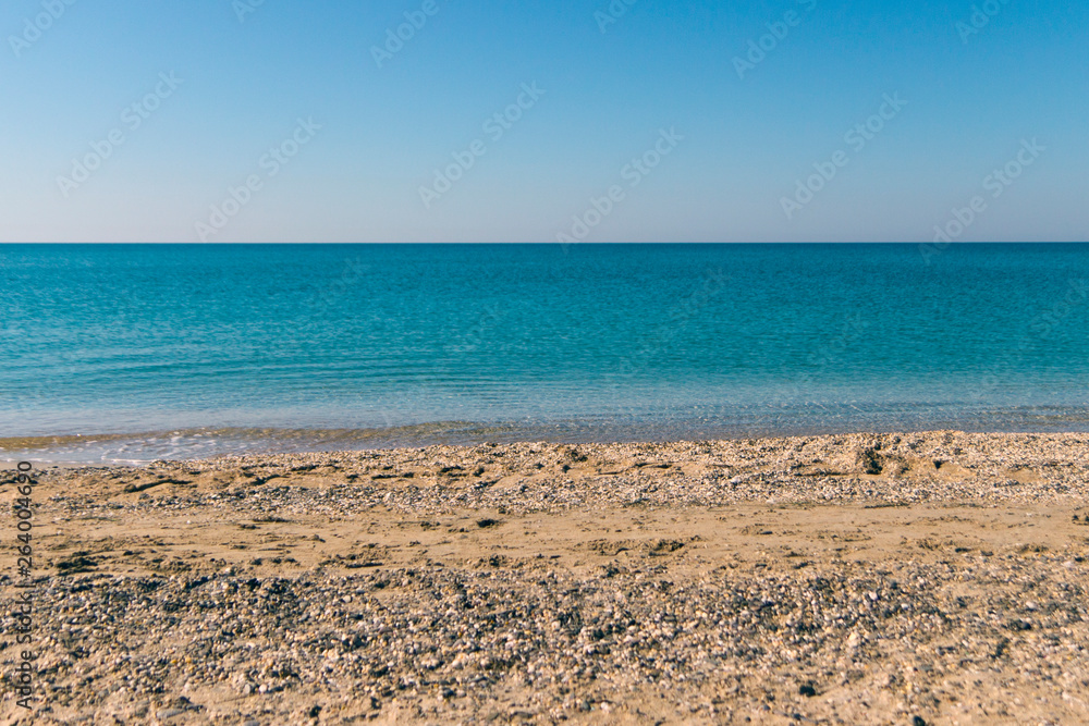 sandy pebble beach of the beautiful turquoise sea