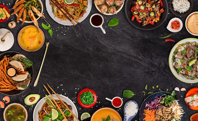 Asian food background with various ingredients on rustic stone background , top view.