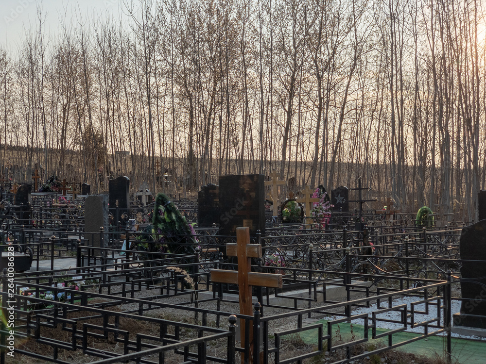 Podolsk, Russia - April 22, 2019: Orthodox cemetery in Russia. Traditional grave decoration