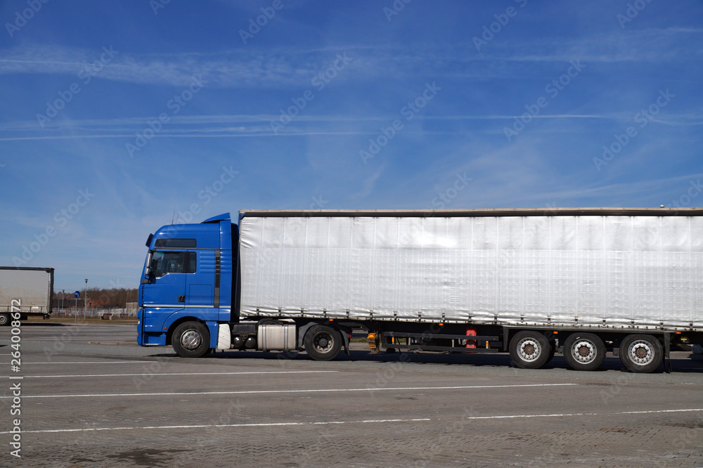 Parking by the highway. Eighteen-wheeler truck when maneuvering in the parking lot. Parking by the highway. Eighteen-wheeler truck when maneuvering in the parking lot.