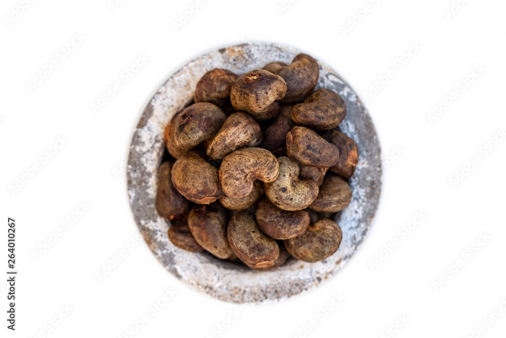 Cashew - bowl filled of raw nuts in the shell Cashew - bowl filled of raw nuts in the shell
