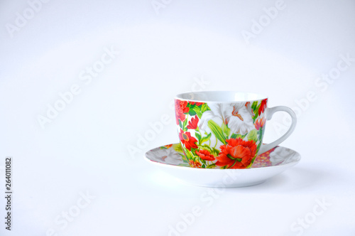 cup on saucer on table on white background