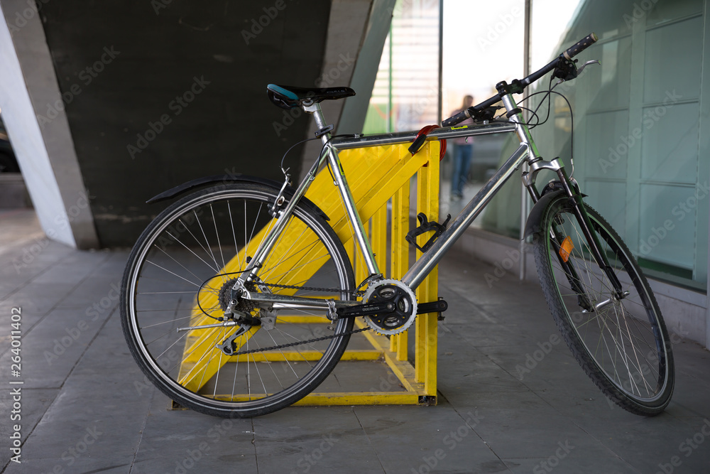 Photo of parked bicycle under the stairs for graphic and web design, for website or mobile app. Photo of parked bicycle under the stairs for graphic and web design, for website or mobile app.