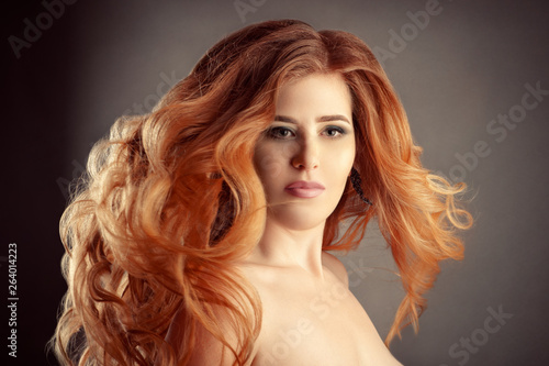 portrait charming woman with magnificent red curly hair