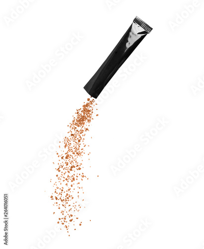 Fotografie Freeze dried instant coffee pours from the packaging, isolated on a white background