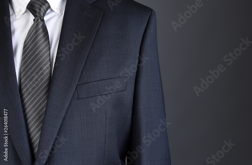 Closeup of a businessman Charcoal Gray Suit with white shirt and tie.