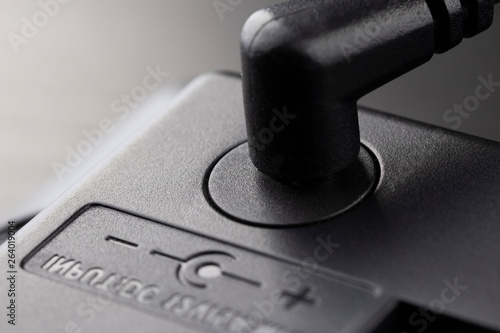 Fotografi Inserted black 12 volt adapter plug.