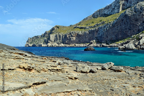 Sea bay with turquoise water, beach and mountains, Cala Figuera on Cap Formentor