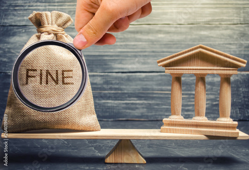 Money bag with the word Fine and the courthouse or bank on the scales of justice. The concept of paying a penalty. Financial punishment. Violations of traffic laws. Fraud. Corruption. Corrupt practice