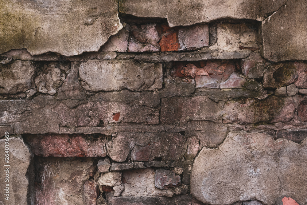 Obraz premium Brick wall of an old destroyed house. Vintage abstract pattern on cement texture. Grunge background. Concrete wall texture.