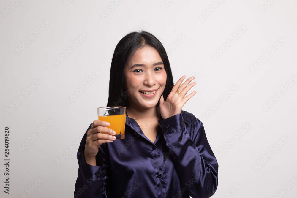 Happy Young Asian woman drink orange juice. Happy Young Asian woman drink orange juice.