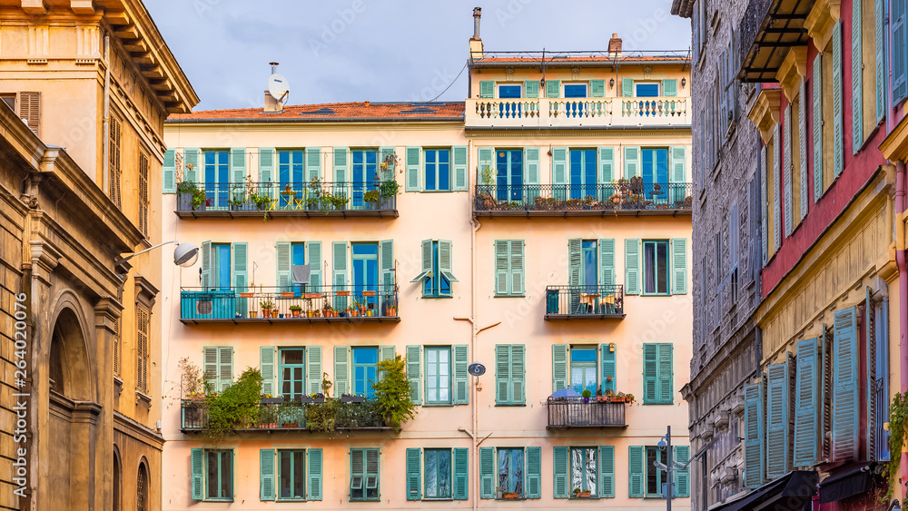 Fototapeta premium Nice, France, colorful facade, with typical windows and shutters
