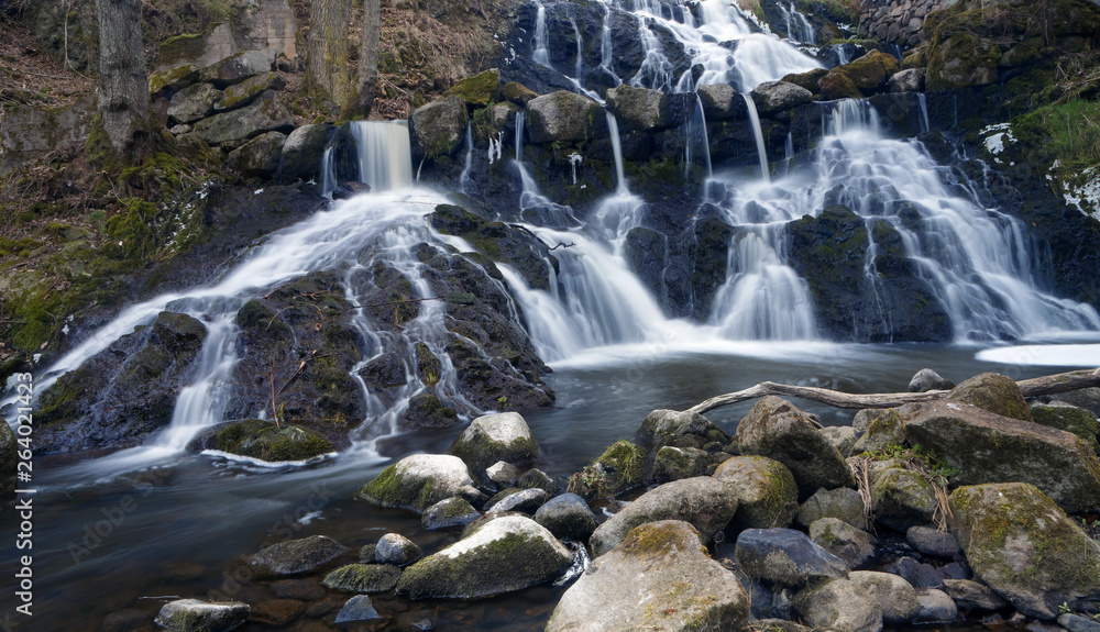 Fototapeta premium Beautful waterfall in the swedish village Rottle during spring