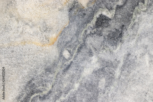 Natural marble background, natural natural texture of an ancient stone. It is used for finishing buildings and embankments, a fine background for a desktop and for photodesign photo