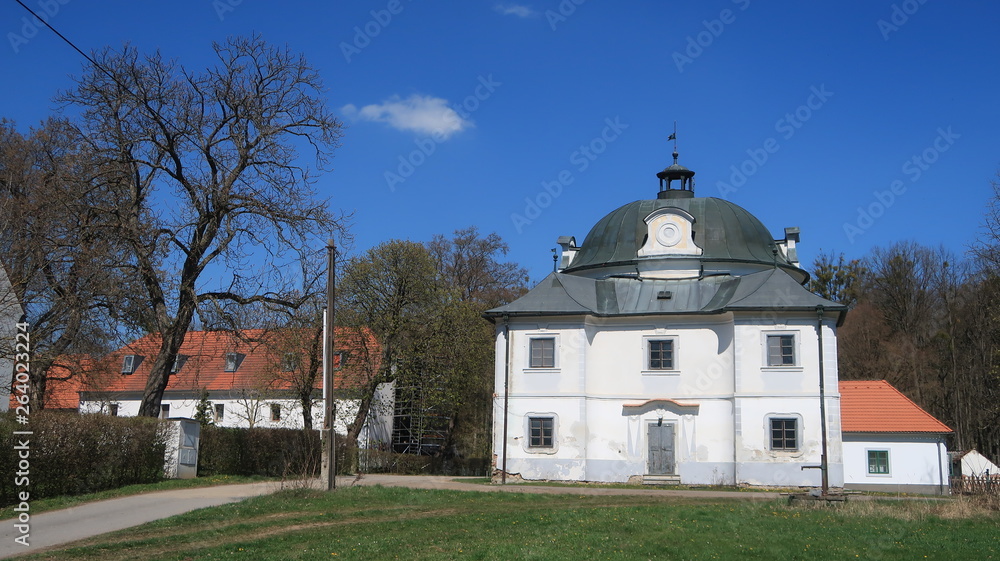 Small baroque castle with blue sky in South Bohemia
