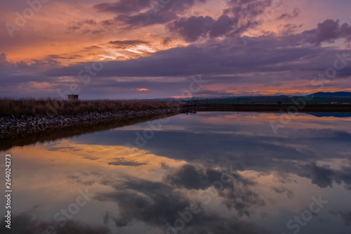 Picturesque landscape with reflections at sunset over the salt-mines in Pomorie  Bulgaria.