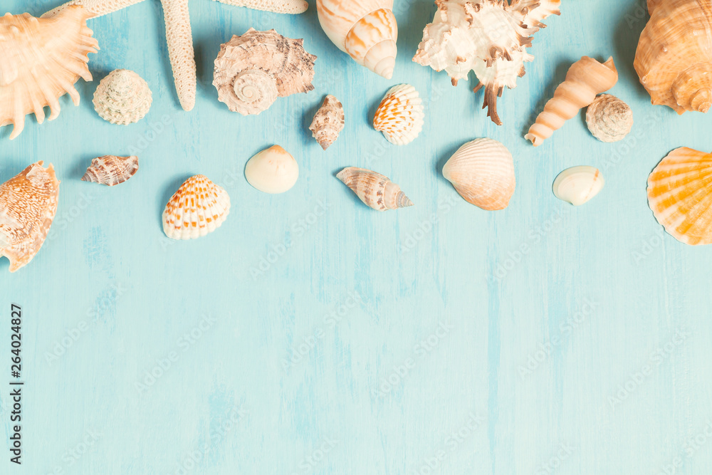Blue sea background with copy space and seashell border, summer holiday and vacation concept Blue sea background with copy space and seashell border, summer holiday and vacation concept
