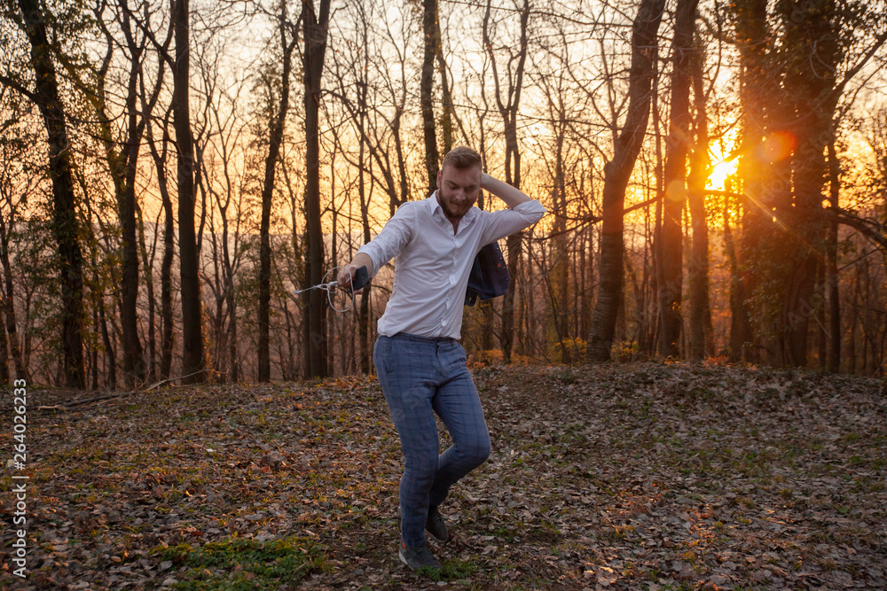 one young man, dancing alone in forest. one young man, dancing alone in forest.