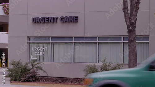 URGENT CARE CLINIC ESTABLISHING SHOT.  EXTERIOR.  IN 4K, LOG, 10 BIT.  LOCK-OFF SHOT.