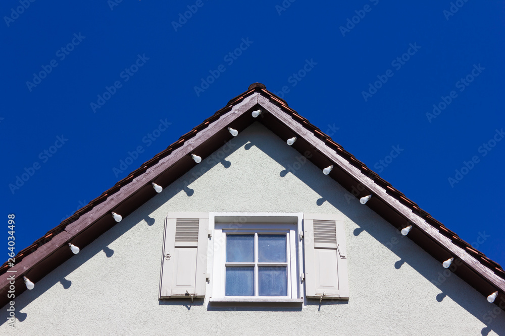 historical house facades and rooftops on blue sky historical house facades and rooftops on blue sky