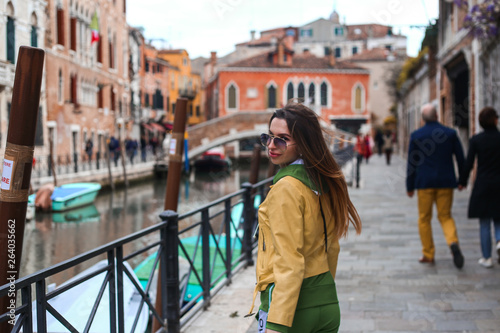 girl on Venice stress with Canal and city view 