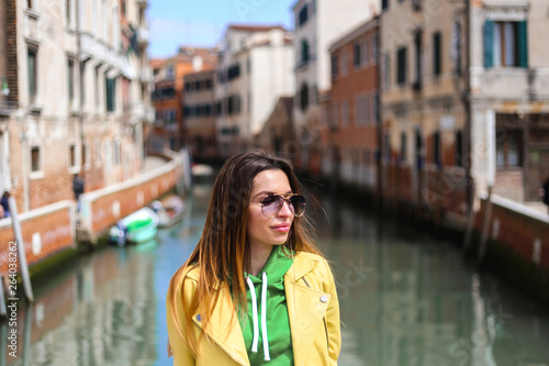 girl on Venice street with canal background. and streets  © Bas
