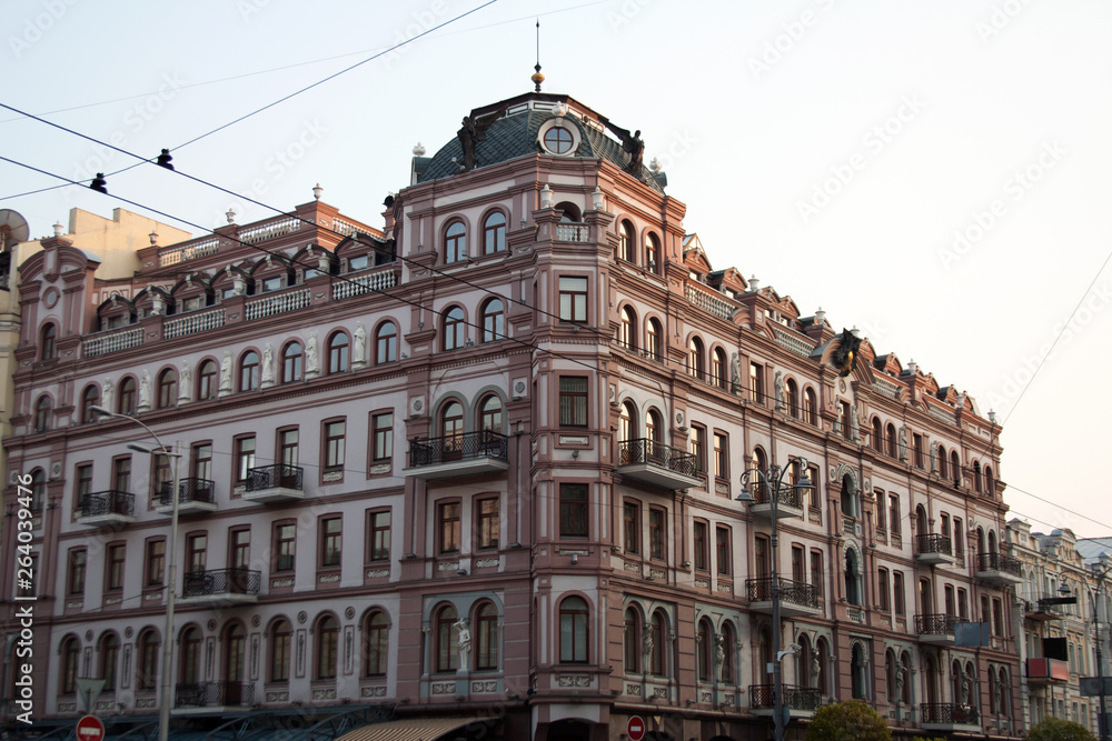 Corner building facade in downtown district of Kyiv city on a spring day