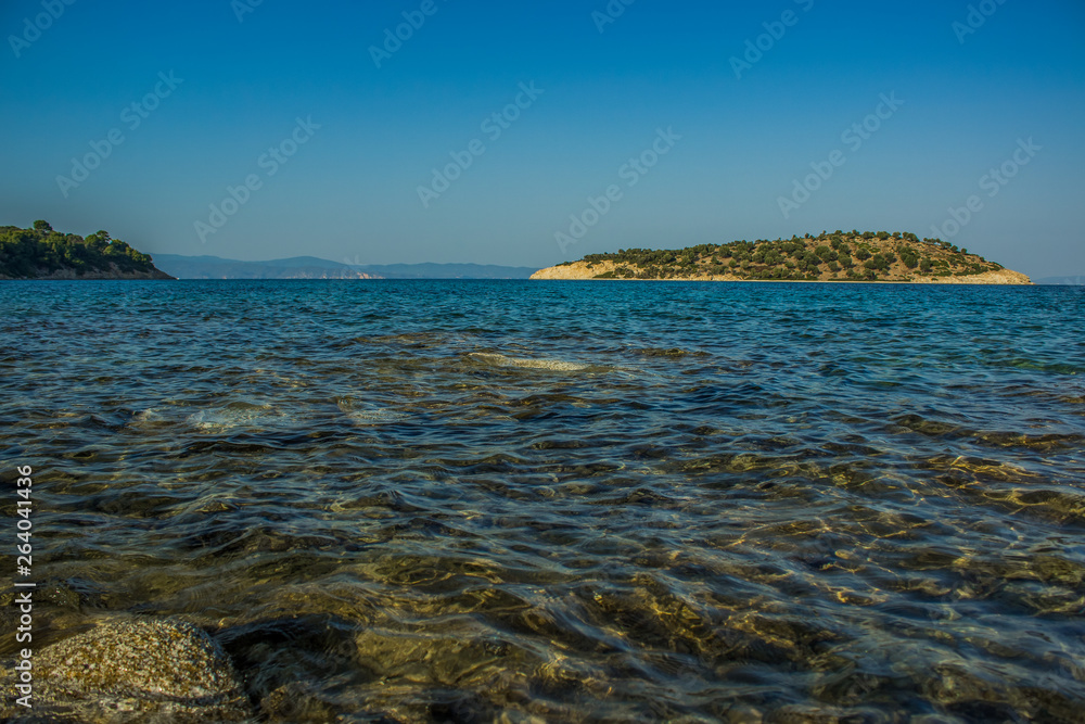 south European scenic landscape Aegean sea bay picturesque island view with water surface foreground in fresh spring season weather time