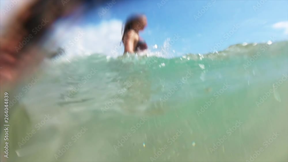 Young cheerful woman run into the tropical sea Young cheerful woman run into the tropical sea