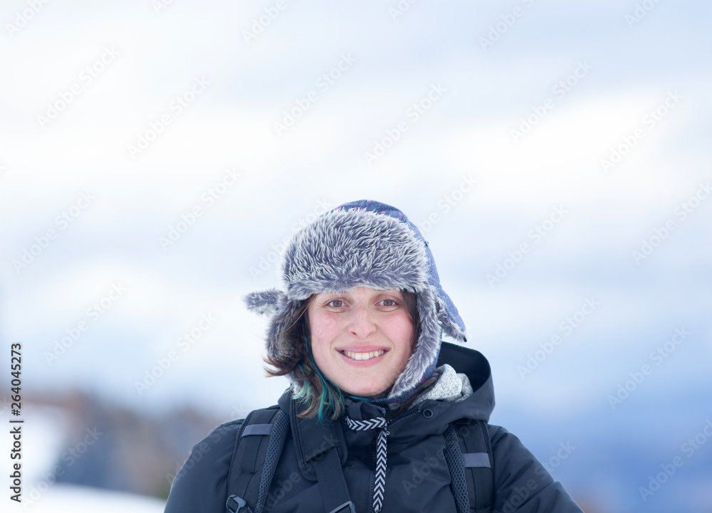 happy woman wearing fur hat in winter happy woman wearing fur hat in winter