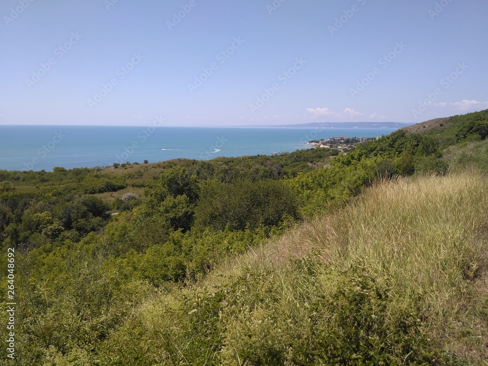 View of the sea from a green grassy hill in Bulgaria. View of the sea from a green grassy hill in Bulgaria.