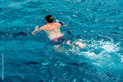 Leisure and sports, guy or man snorkeling in the blue sea