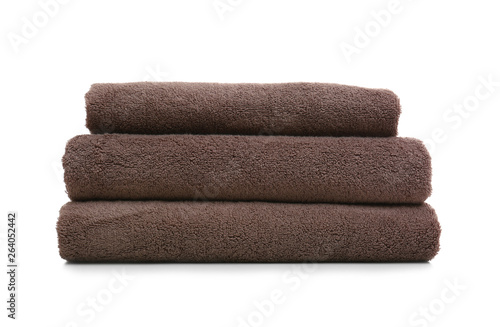 Stack of clean folded towels on white background